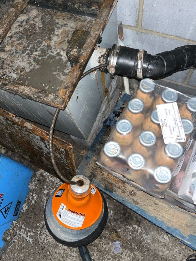 Using electro mechanical machine to clear blocked wastepipe