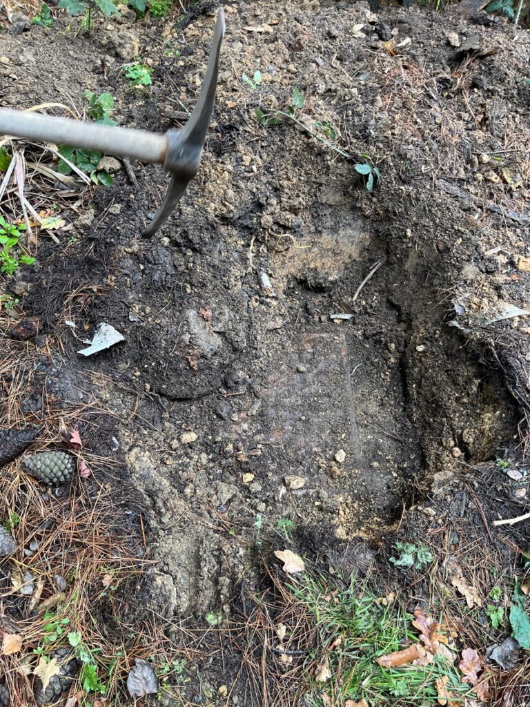 Locating a buried manhole chamber